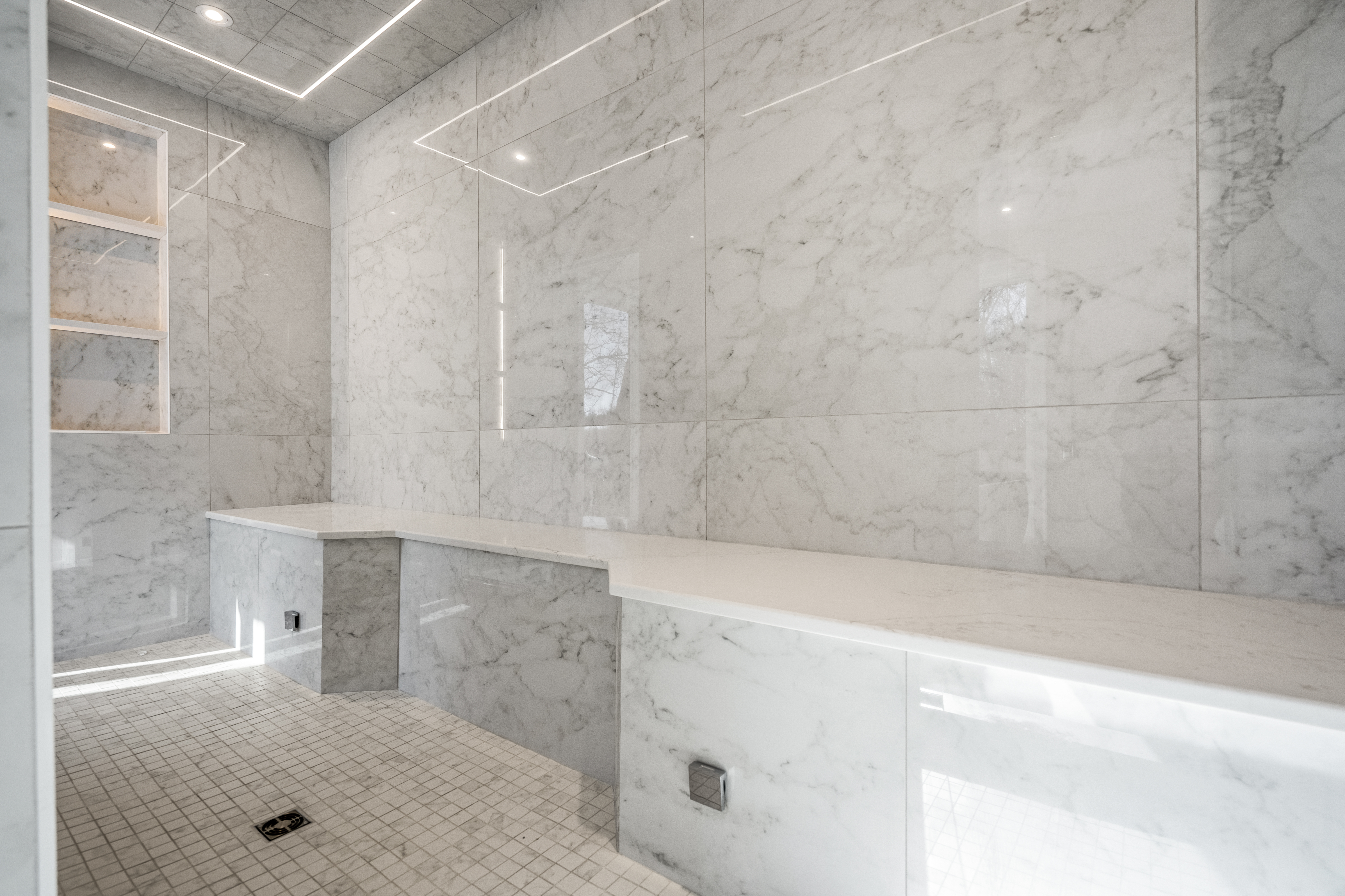 Luxury shower wall fixtures and marble tile