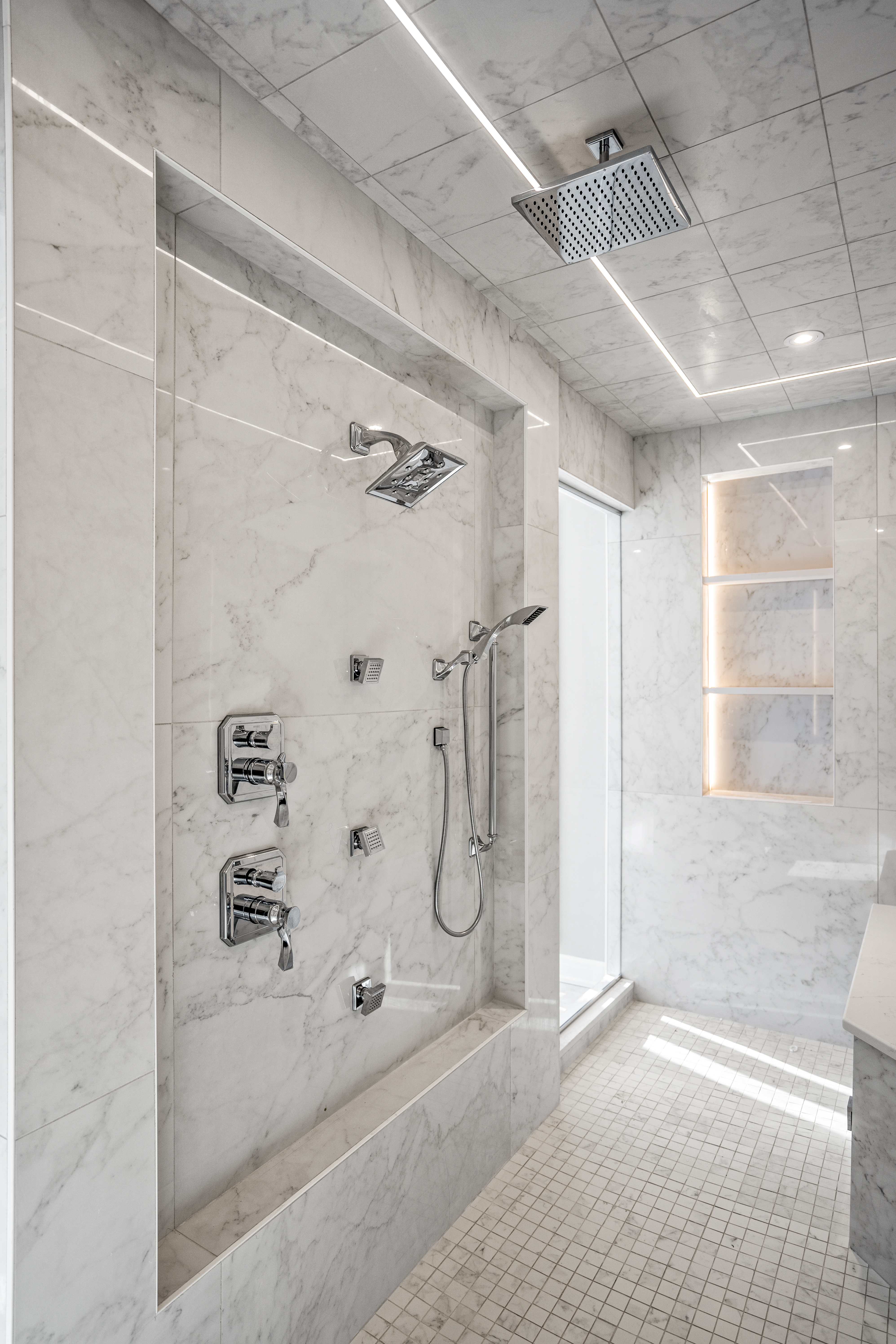 Luxury marble steam room with custom bench